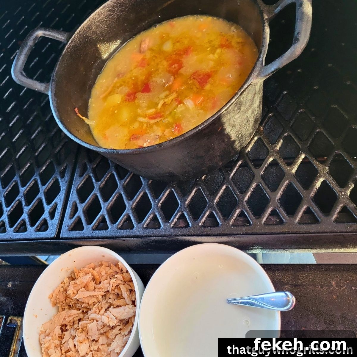 Creamy Smoked Salmon Chowder Recipe for Cozy Weeknight Dinners 7 Salmon chowder base in smoker with bowl of shredded Salmon and bowl of heavy whipping cream on grill shelf