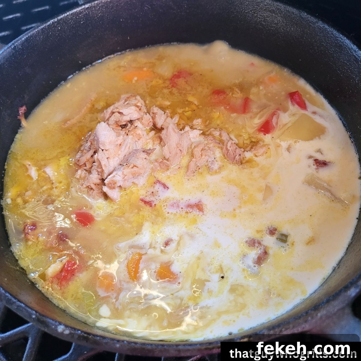 Creamy Smoked Salmon Chowder Recipe for Cozy Weeknight Dinners 8 Smoked Salmon Chowder in dutch oven with heavy creamer added to it