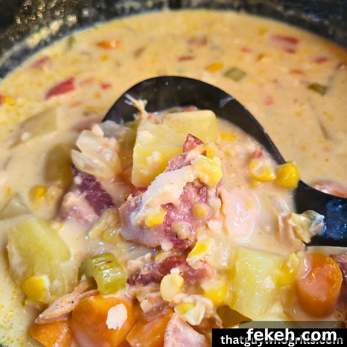 Creamy Smoked Salmon Chowder Recipe for Cozy Weeknight Dinners 9 Ladle scooping out salmon chowder out of dutch oven
