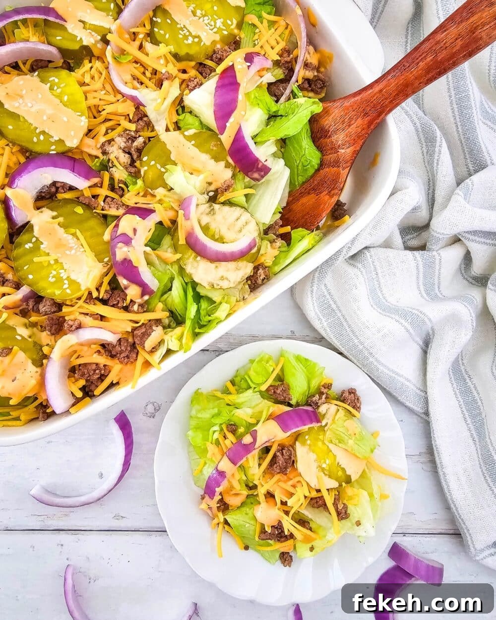 Keto Big Mac Salad: High-Protein Low-Carb Cheeseburger Bowl 2 Keto Big Mac Salad in a casserole dish with wooden spoon, and on a plate single serving