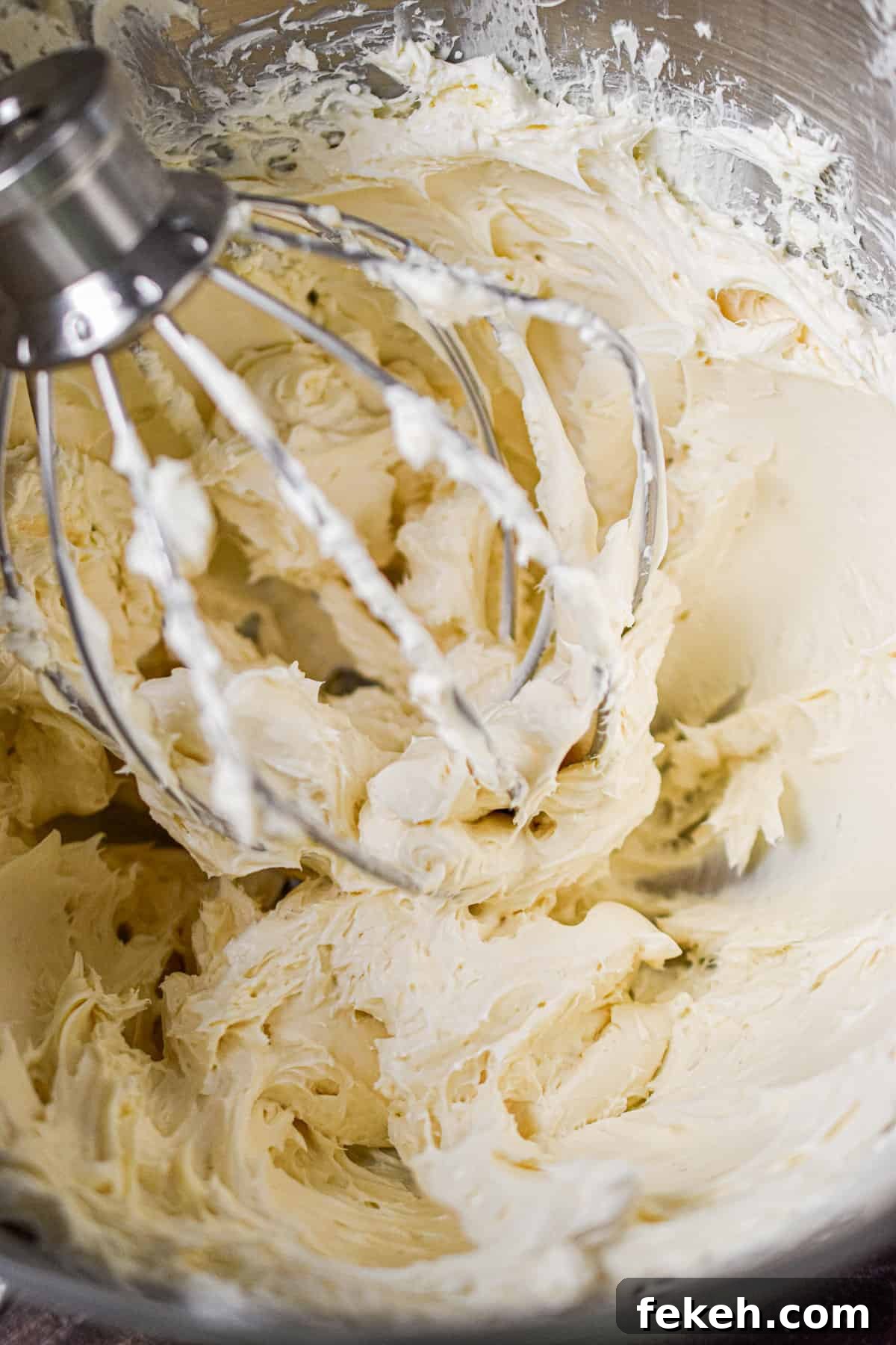 Cream Cheese Frosting Recipe: Smooth, Tangy, Ready in Minutes 4 The whisk attachment is in the bowl with the icing.