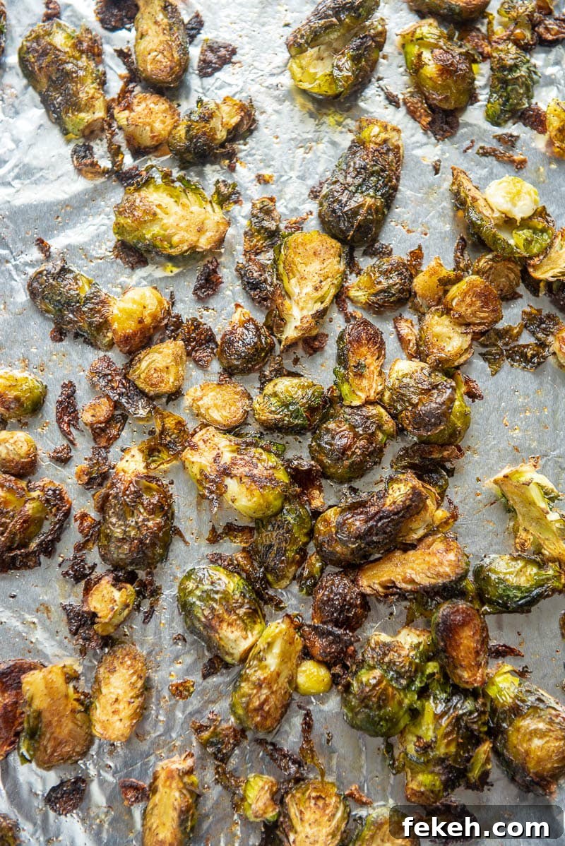 Crispy Spicy Brussels Sprouts with Garlic and Chili 6 baked spicy brussels sprouts on a baking sheet