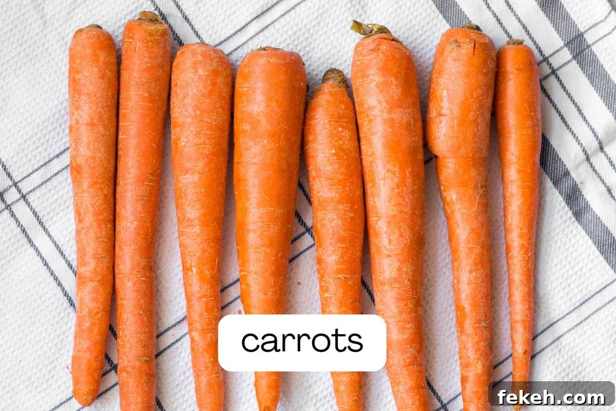 Carrot Purée: Homemade Baby Food & Versatile Side Dish 3 carrots lined up