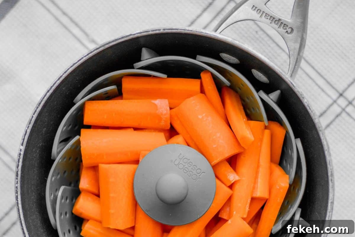 Carrot Purée: Homemade Baby Food & Versatile Side Dish 5 cut carrots in a steamer basket