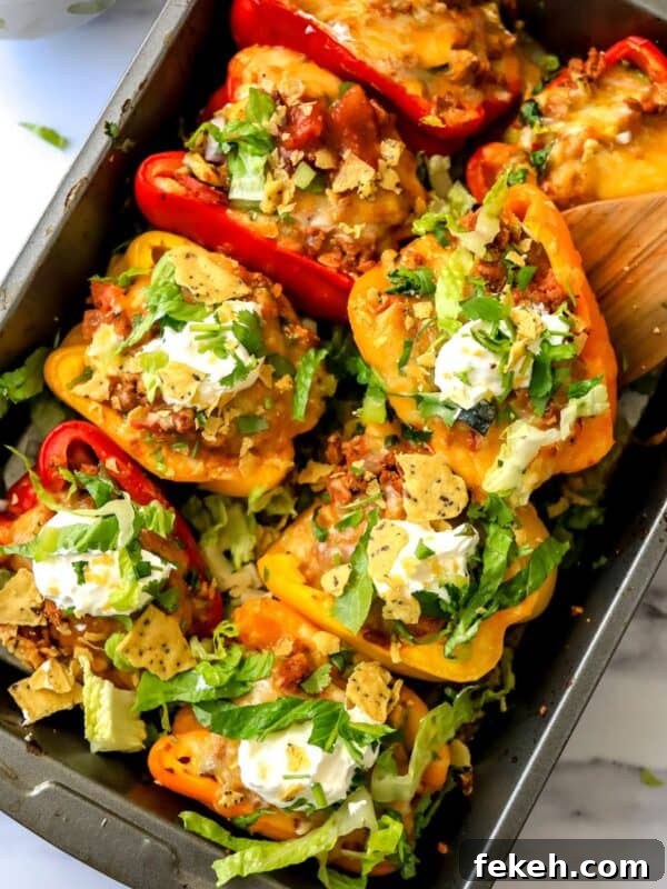 Creative Pizza Bowl Recipes: Flavorful Mini Pizza Bowls for Any Meal 8 Baking dish with taco stuffed peppers in it and a wooden spatula.