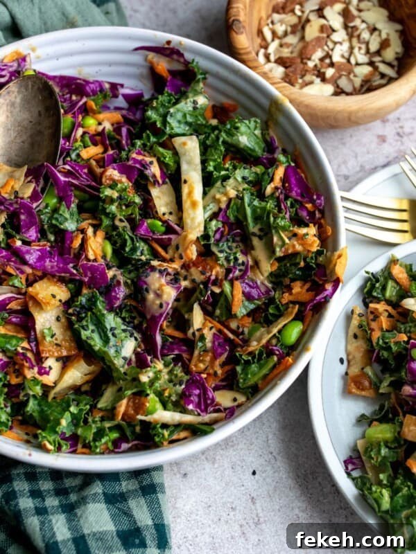 Creative Pizza Bowl Recipes: Flavorful Mini Pizza Bowls for Any Meal 9 Cabbage salad in a white bowl with serving utensils.