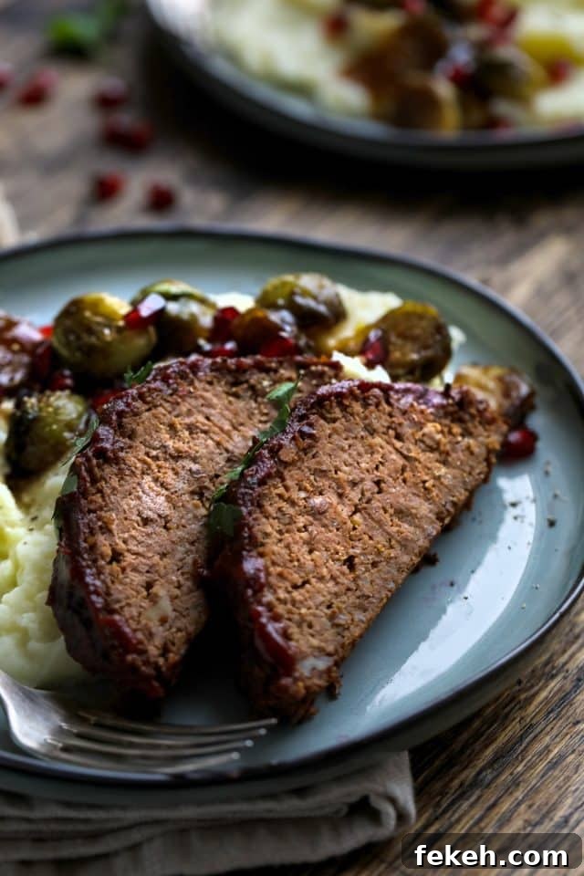 Vegetarian Roast Dinner Ideas for a Comforting Sunday Meal 2 Vegan loaf on a plate with sides.