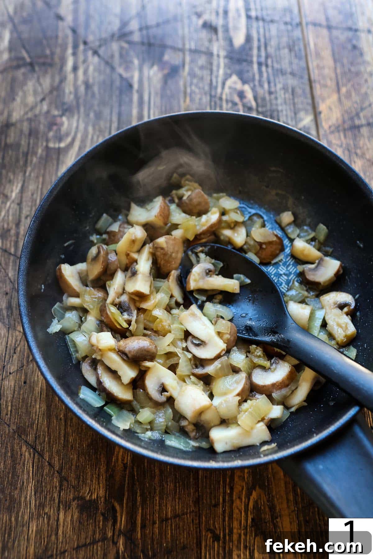 Vegetarian Roast Dinner Ideas for a Comforting Sunday Meal 7 Sauteed mushroom with onions in a pan.