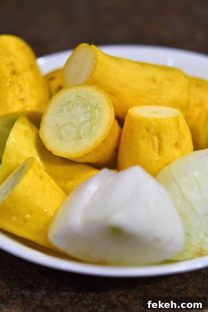 Creamy Summer Squash Alfredo Pasta Recipe 4 yellow squash and onion, cut up and ready for cooking
