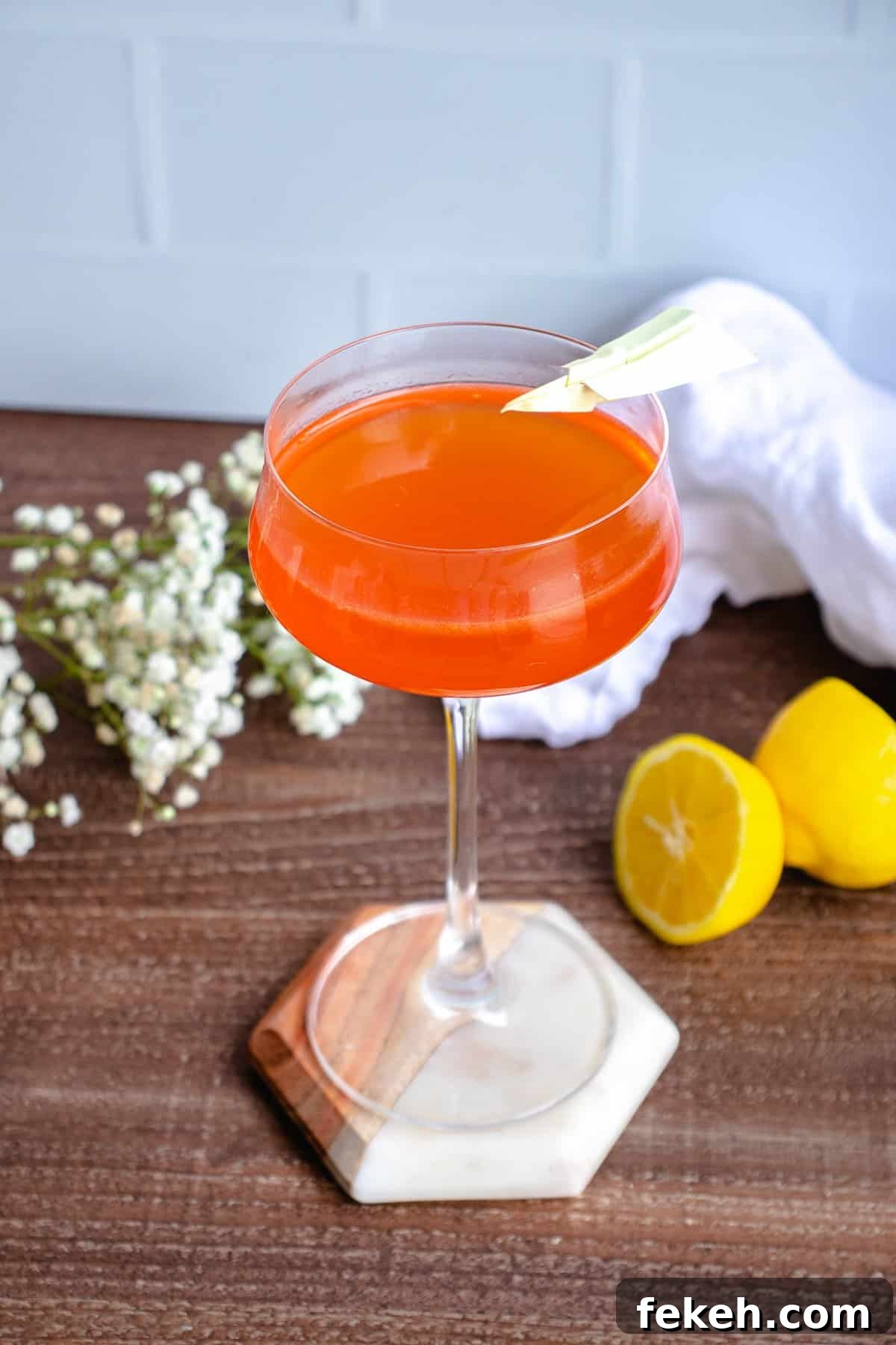 22 Elegant Cocktail Recipes for Sophisticated Events 3 Paper plane cocktail with lemons.