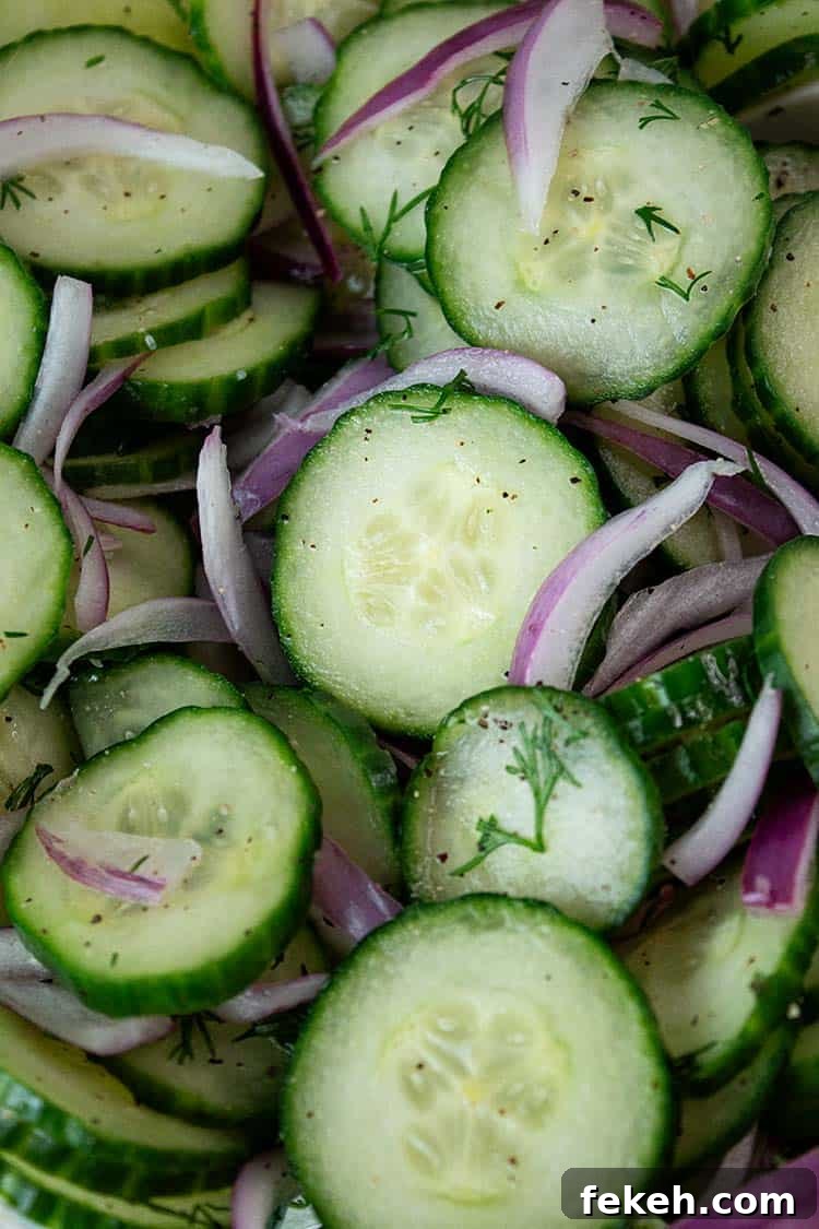 overhead view of cucumber salad with onions ready to serve