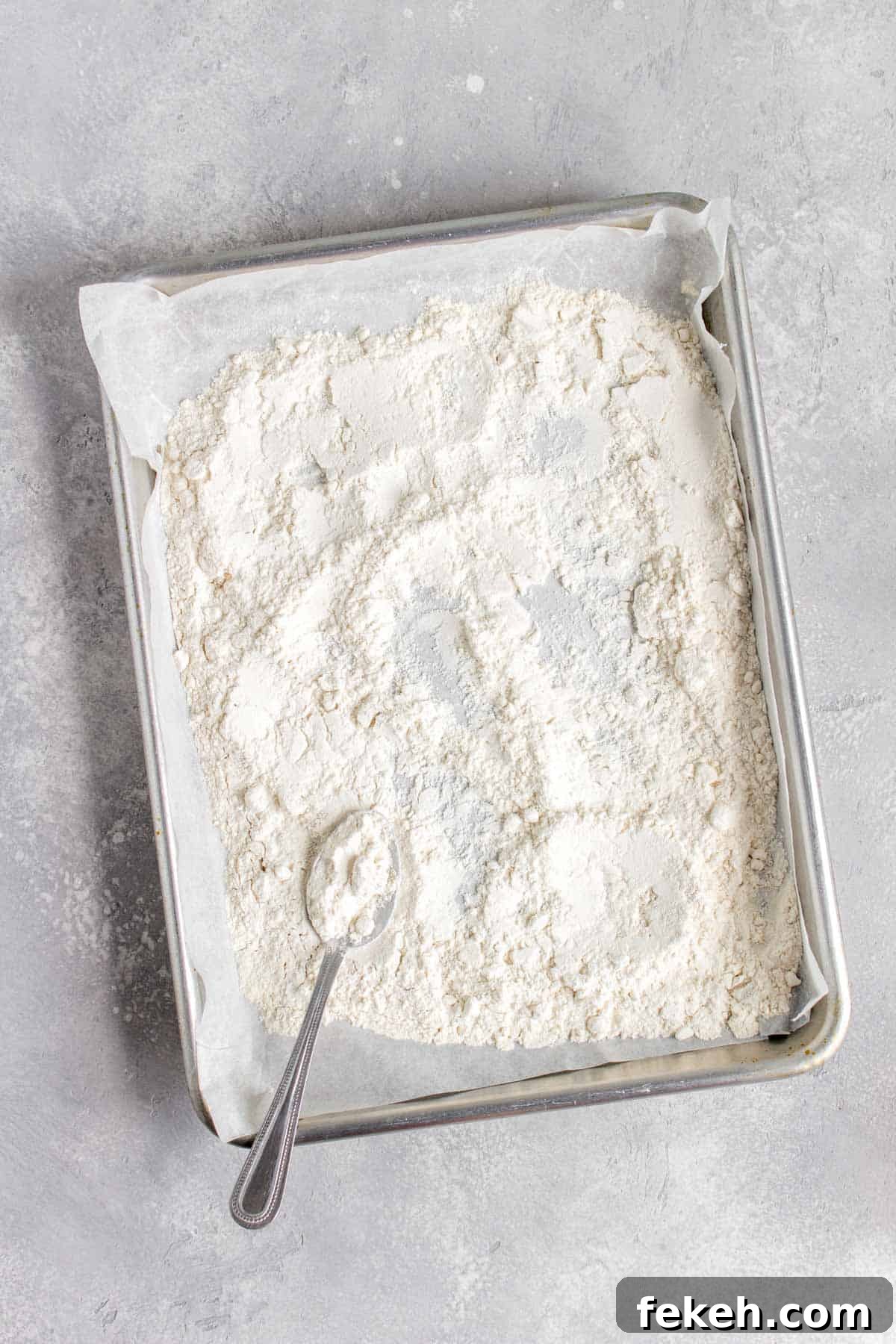 Safe-to-Eat Chocolate Chip Cookie Dough Recipe 5 Flour in a lined sheet pan.