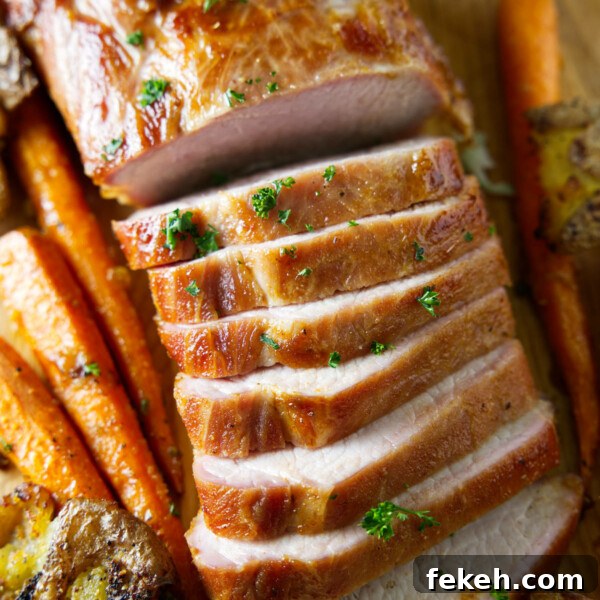 Smoked Pork Butt (Smoked Pork Shoulder) Recipe for Tender, Juicy Meat 14 sliced whole smoked pork loin on cutting board