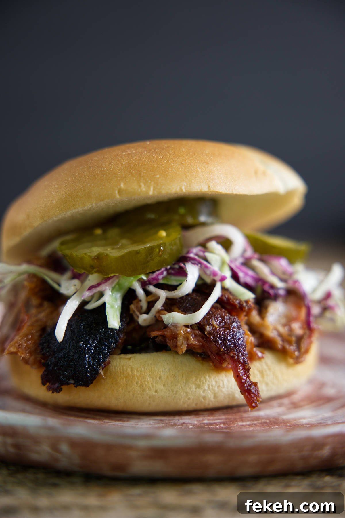 Smoked Pork Butt (Smoked Pork Shoulder) Recipe for Tender, Juicy Meat 18 Pulled pork sandwich with slaw and pickles.