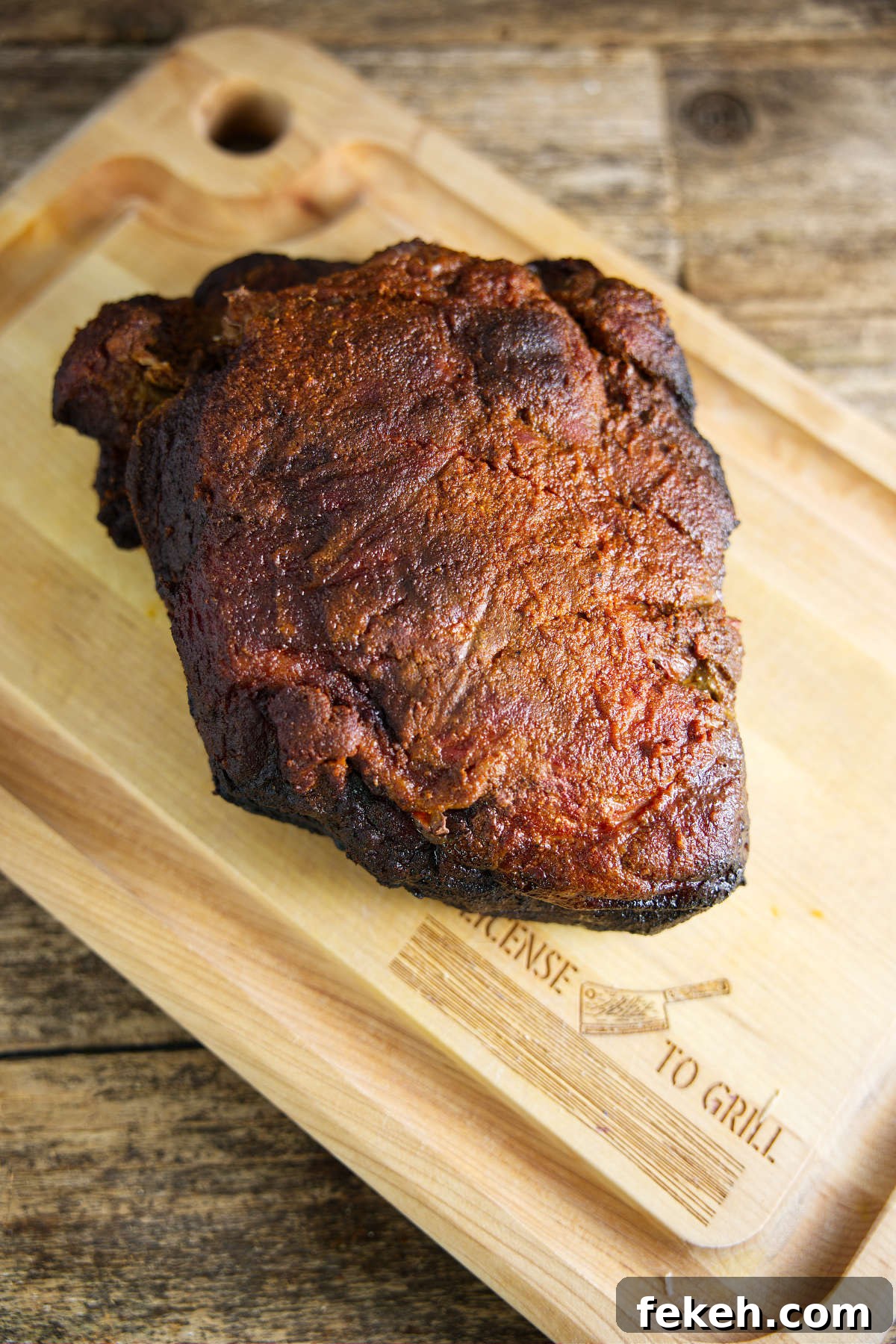 Smoked Pork Butt (Smoked Pork Shoulder) Recipe for Tender, Juicy Meat 3 Smoked pork shoulder on butcher block.