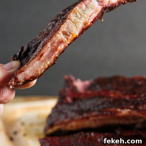 Smoked Pork Butt (Smoked Pork Shoulder) Recipe for Tender, Juicy Meat 23 traeger smoked pork spare ribs, sliced and one being held