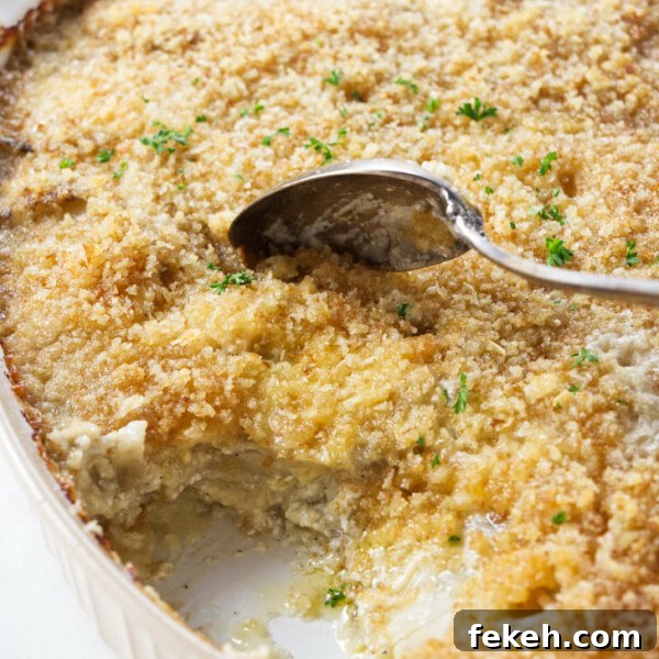Smoked Pork Butt (Smoked Pork Shoulder) Recipe for Tender, Juicy Meat 25 A casserole dish filled with au gratin potatoes.