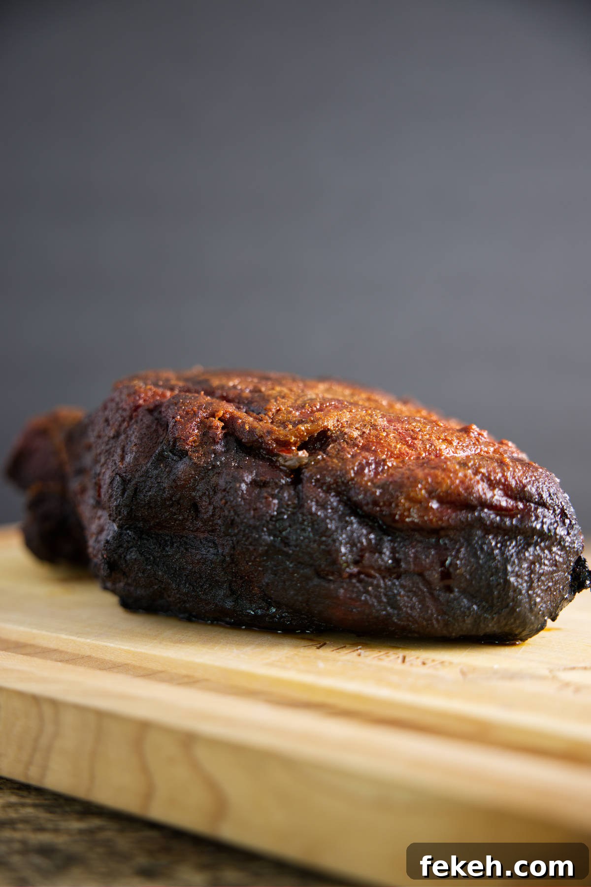 Smoked Pork Butt (Smoked Pork Shoulder) Recipe for Tender, Juicy Meat 26 Smoked pork butt on butcher block.