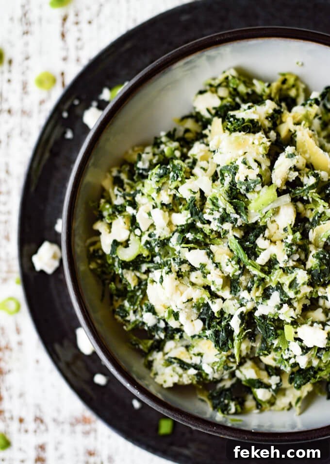 Spinach Puff Pastry Bites: Flaky Savory Appetizer Recipe 3 Spinach and artichoke filling in a black and white bowl