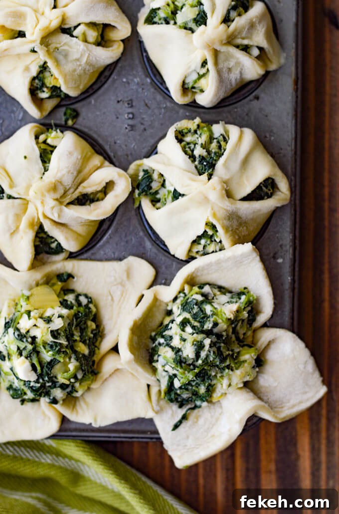 Spinach Puff Pastry Bites: Flaky Savory Appetizer Recipe 4 Unbaked puff pastry with spinach filling in mini muffin tins.