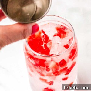 Vanilla and coconut syrup being poured into the glasses.