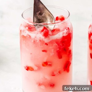 Coconut creme and strawberry puree stired in the glasses.
