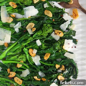 Garlicky Sautéed Broccoli Rabe with Lemon and Chili Flakes 7 Overhead shot of broccoli rabe with garlic on a white platter.