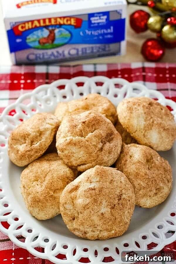 Snickerdoodle Cream Cheese Cookies piled on a plate.