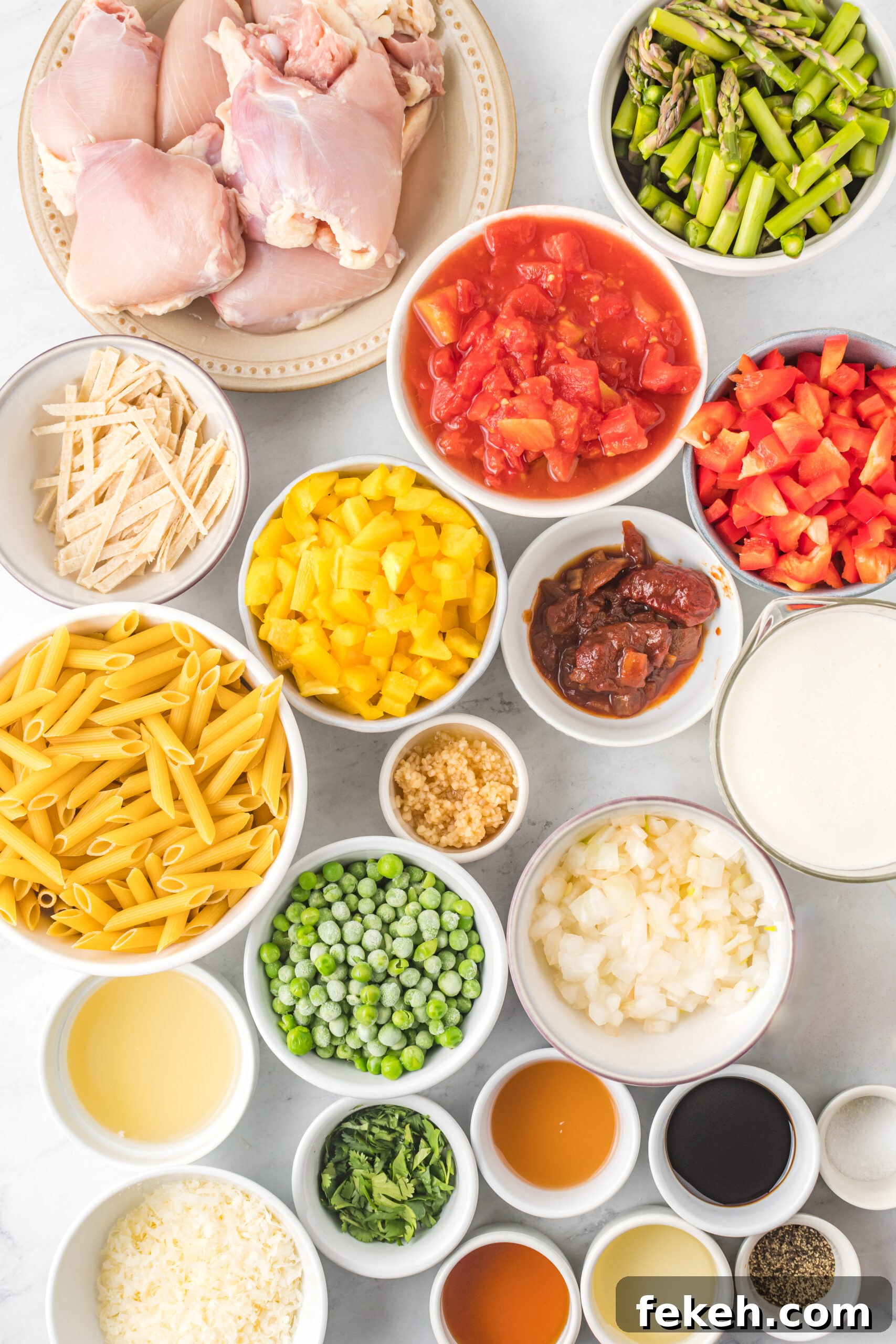 Cajun Chicken Pasta Recipe with Creamy Parmesan Sauce 8 Overhead view of the ingredients needed to complete this recipe.