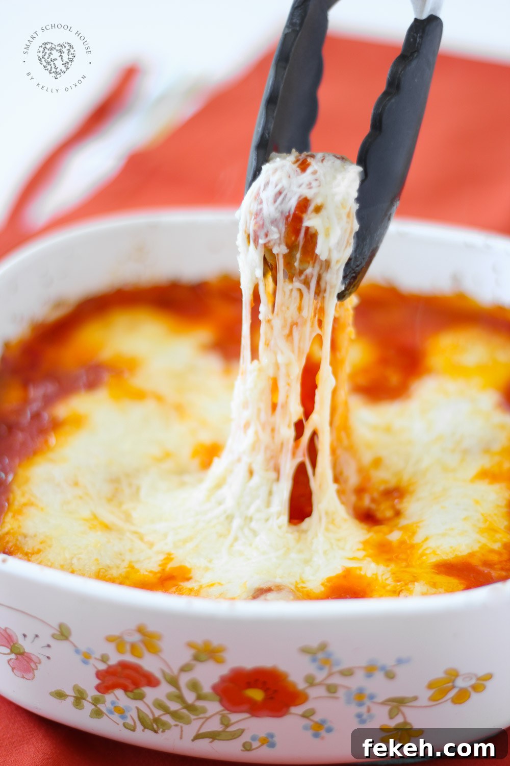 Meatball Parmigiana is cheesy meatballs with tomato sauce baked right in the oven, no mess or frying! Good enough for a fancy dinner to serve for a holiday and is also kid friendly. You’ll Be Head Over Heels For This Baked Meatball Parmesan Casserole