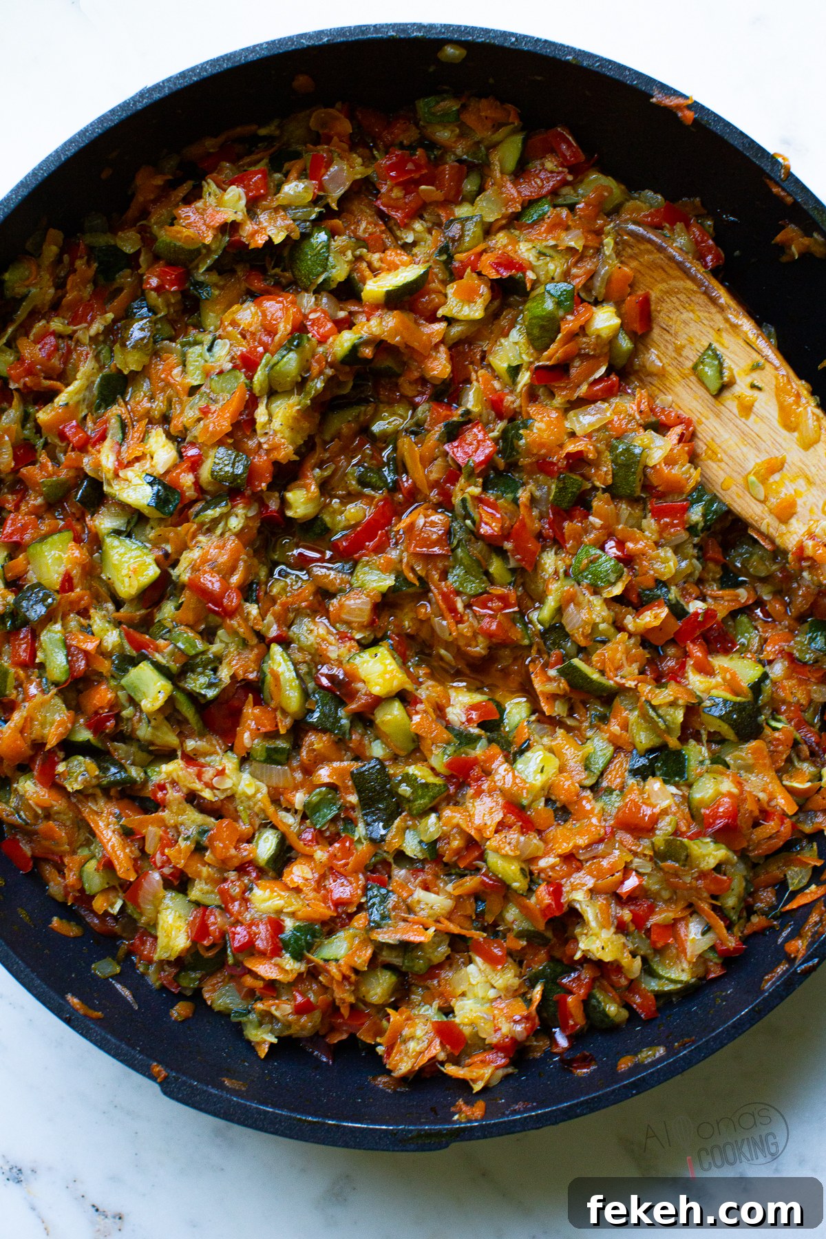 zucchini ikra is cooked down in a skillet zucchini spread in a skillet