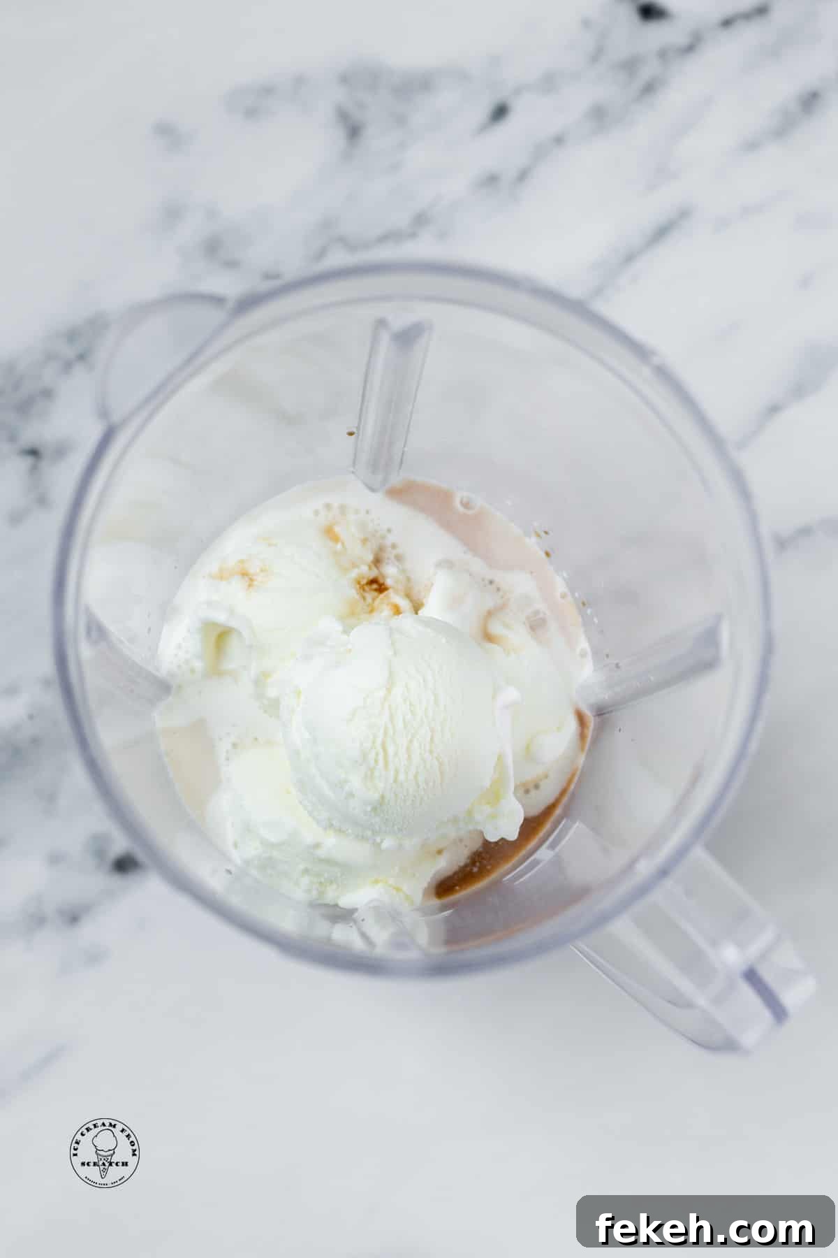 Classic Vanilla Milkshake Recipe: Creamy Homemade Shake in Minutes 4 The ingredients for a vanilla milkshake in a blender jar, viewed from above