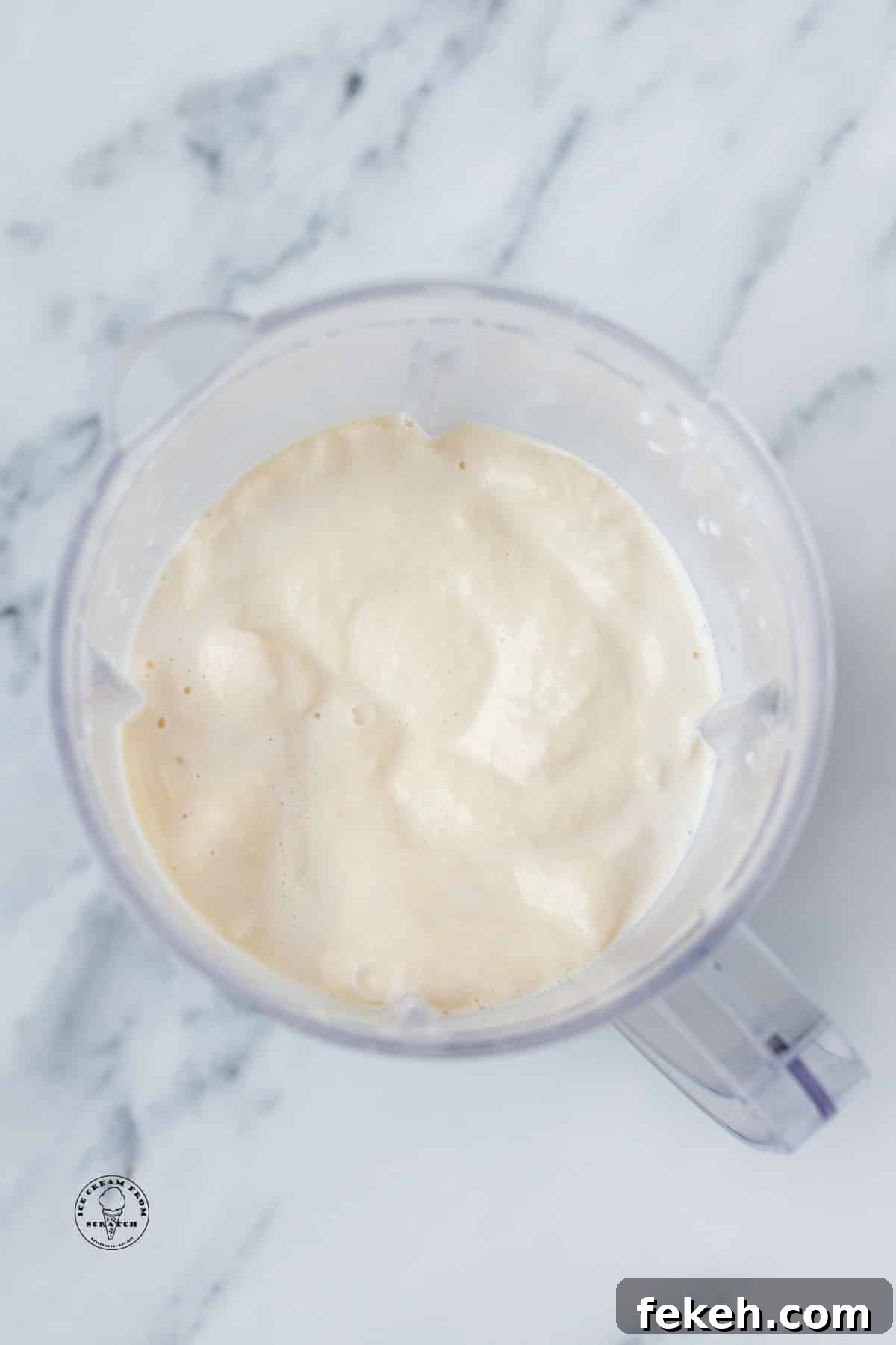 Classic Vanilla Milkshake Recipe: Creamy Homemade Shake in Minutes 5 a creamy blended vanilla milkshake in a blender, viewed from above