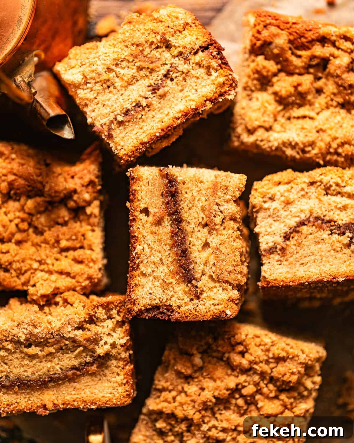 Cardamom Coffee Cake Recipe: Aromatic Spiced Bundt Cake 2 cardamom coffee cake cut into squares and scattered about on a piece of parchment paper.