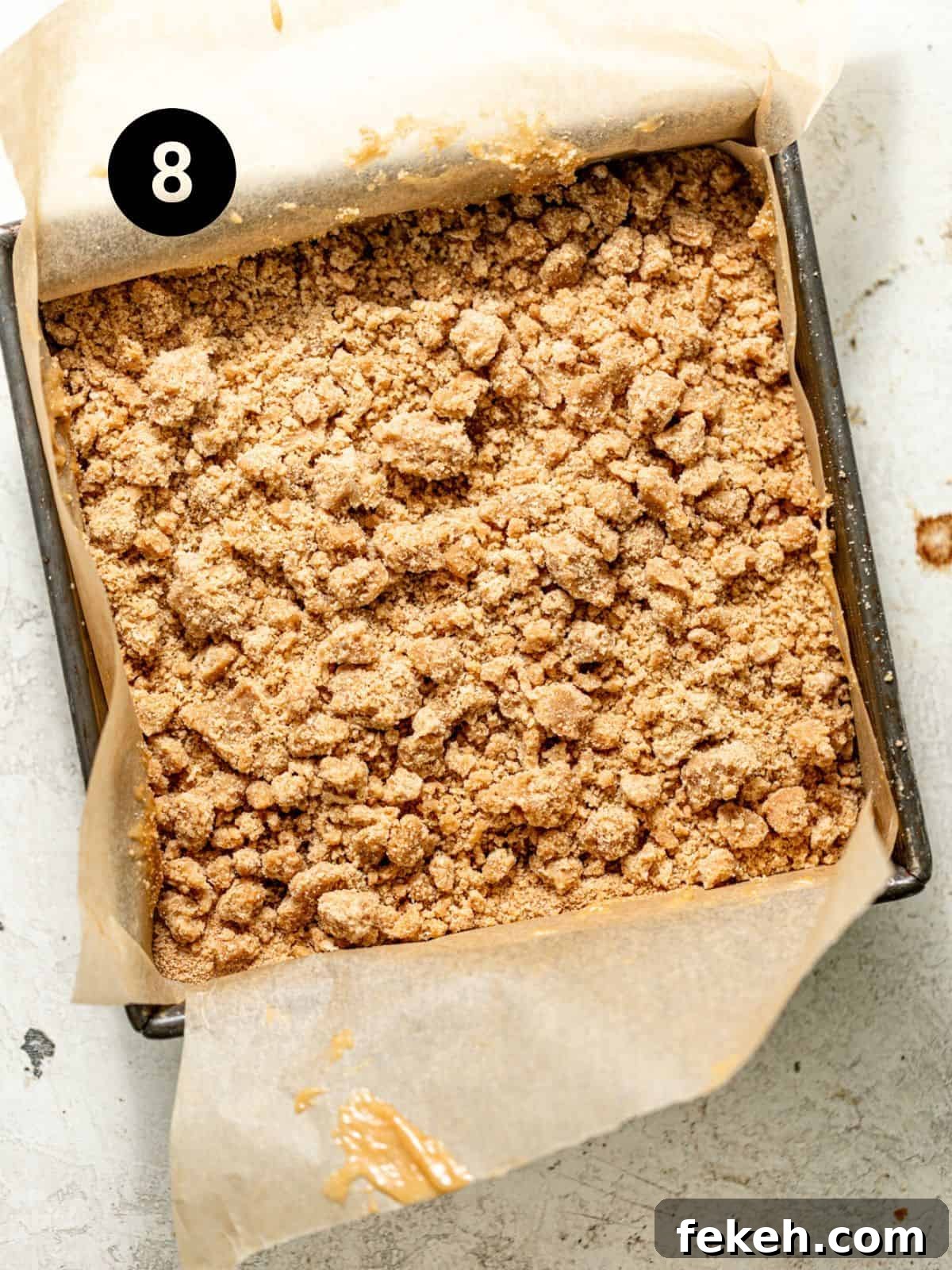 Cardamom Coffee Cake Recipe: Aromatic Spiced Bundt Cake 11 cardamom coffee cake batter assembled in a parchment lined square baking pan.