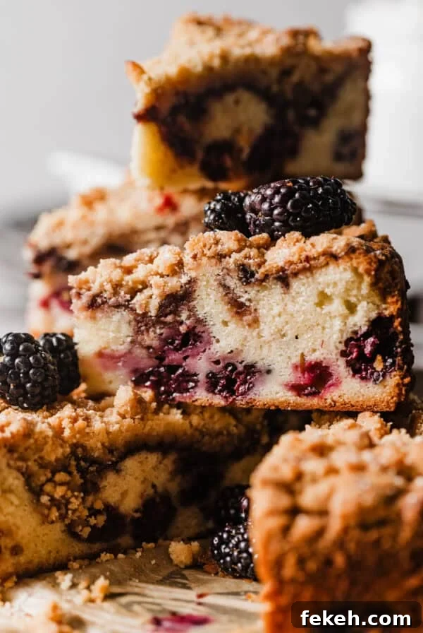 Cardamom Coffee Cake Recipe: Aromatic Spiced Bundt Cake 14 sliced blackberry coffee cake on a plate stacked on top of each other.