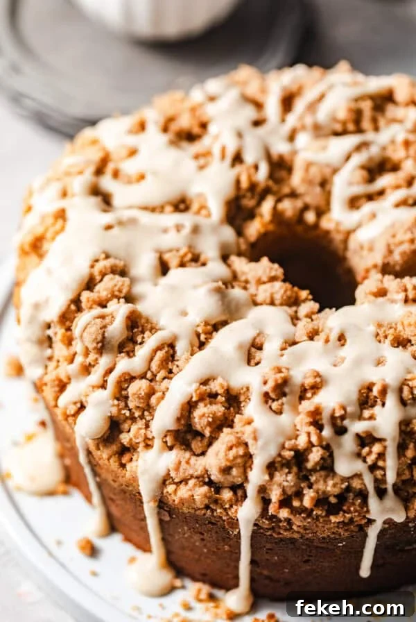 Cardamom Coffee Cake Recipe: Aromatic Spiced Bundt Cake 16 overhead photo of coffee cake bundt cake with brown butter glaze drizzled all over the cake.