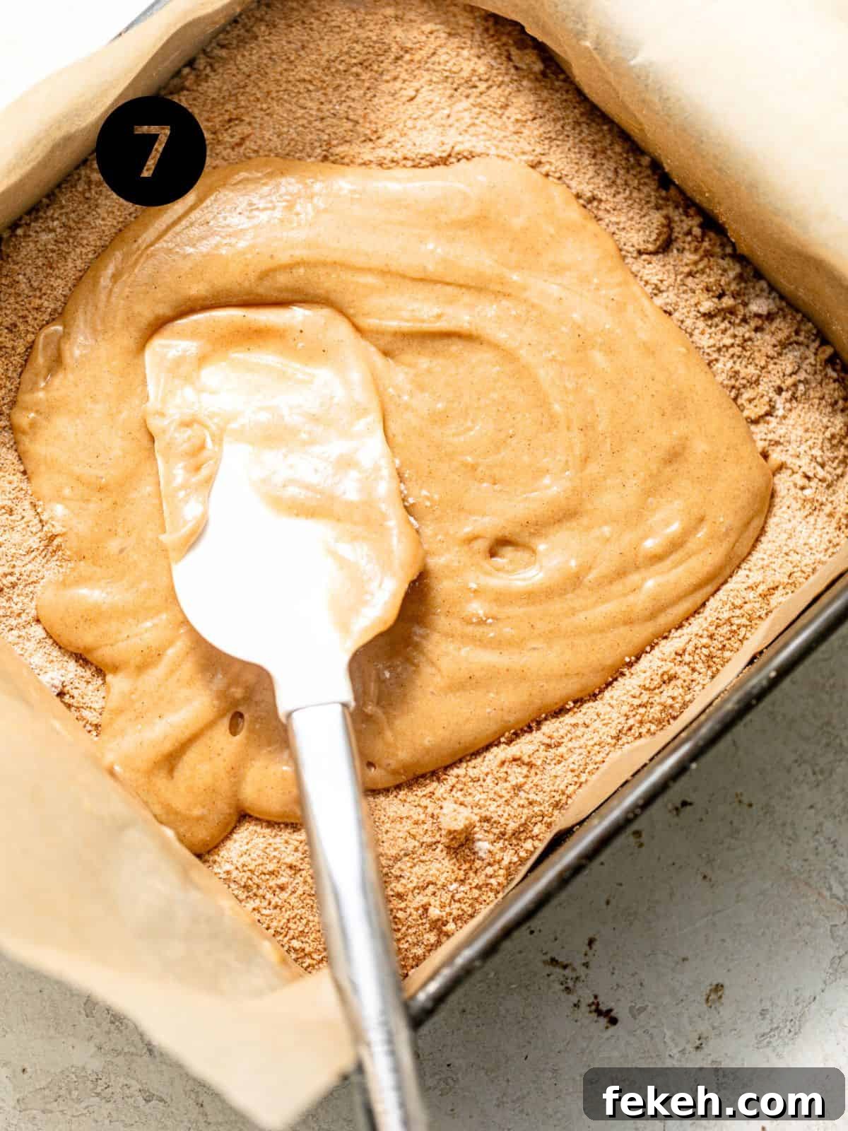 Cardamom Coffee Cake Recipe: Aromatic Spiced Bundt Cake 10 cake batter in the pan with the filling sprinkled onto the middle.