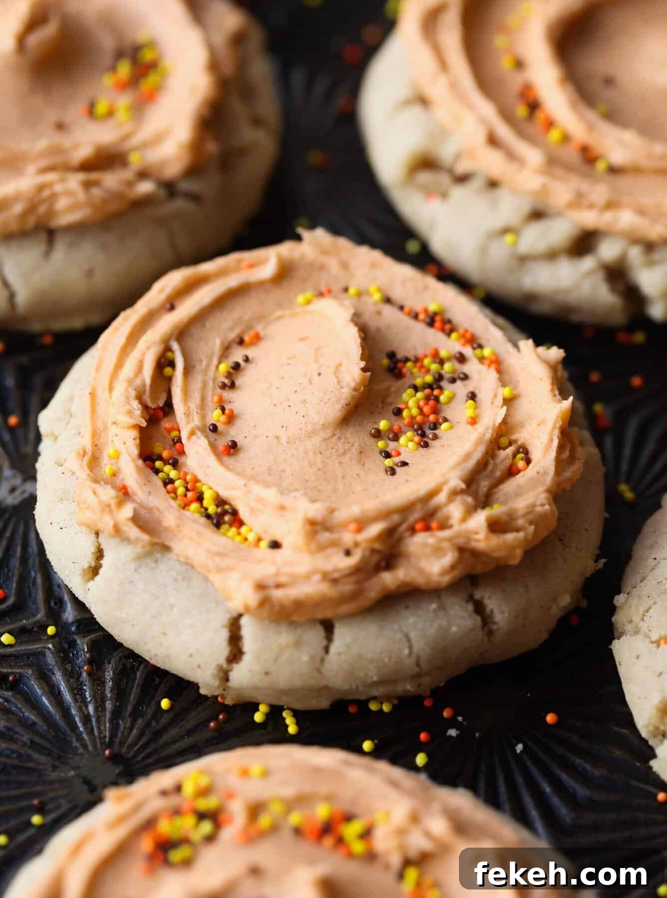 Browned butter frosting on pumpkin spice cookies A close up of the browned butter frosting on these holiday sugar cookies, covered in sprinkles