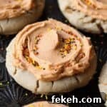 A close up of the browned butter frosting on these holiday sugar cookies