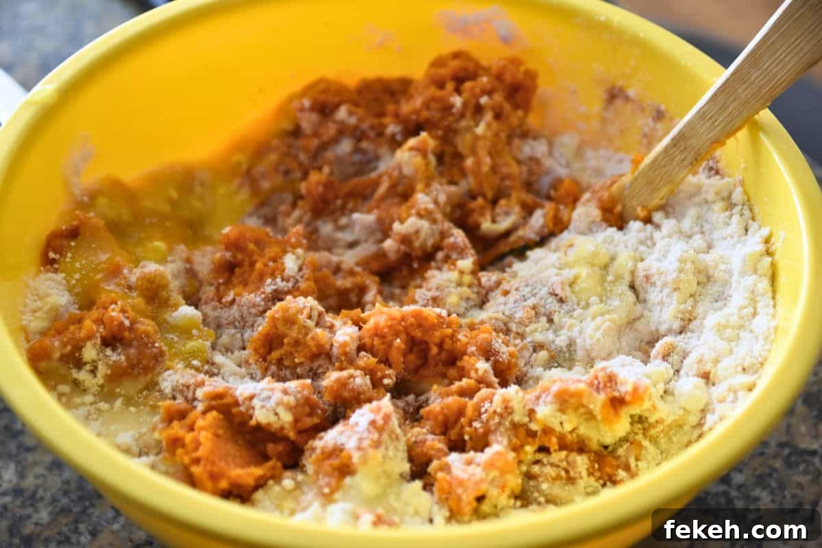 Low-Calorie Pumpkin Muffins for Weight Watchers-Friendly Diet 3 mixing pumpkin muffin batter
