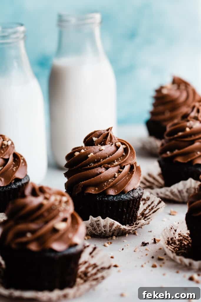 Nutella Chocolate Cupcakes with Cream Cheese Nutella Frosting 10 Nutella cupcakes with crushed hazelnuts sprinkled on top.