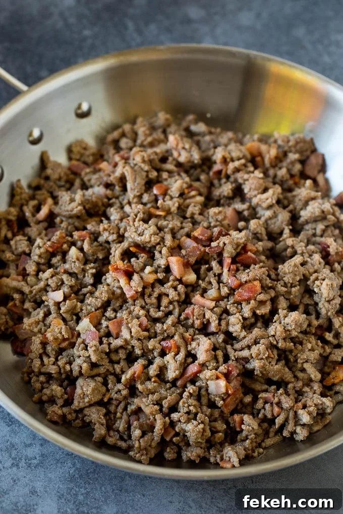 Pasta bolognese with spaghetti tossed in the most delicious homemade meat sauce. Ground beef and pancetta cooked in a pan.