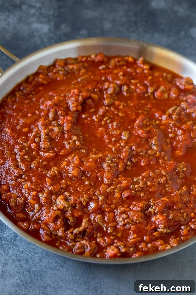 Pasta bolognese with spaghetti tossed in the most delicious homemade meat sauce. Meat sauce for pasta in a skillet.