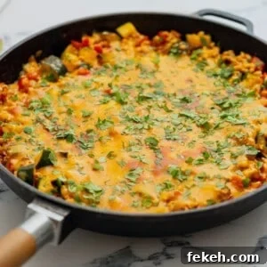 One-Pan Turkey Taco Skillet Recipe for Quick Weeknight Dinners 3 Skillet with ground turkey with taco seasoning and veggies.