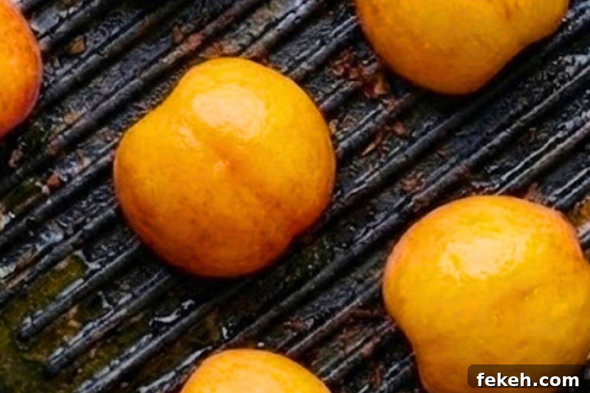 Maple-Grilled Peaches with Almond Cookie Crumble 8 Brush peaches with maple syrup and grill cut-side down until caramelized.