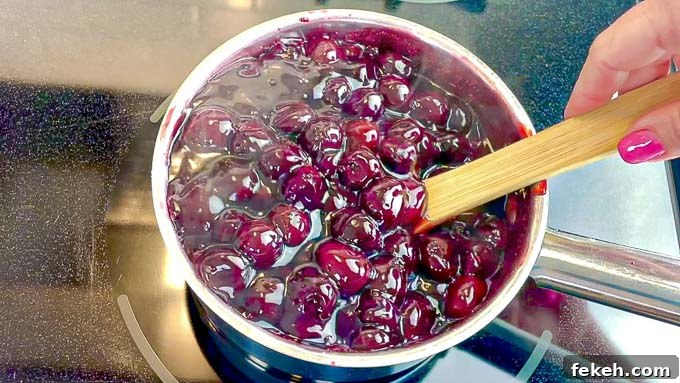 Homemade Cherry Pie Filling Recipe for Fresh, Luscious Pies 5 Homemade Cherry Pie Filling being stirred in a sauce pan
