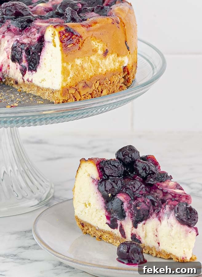 Homemade Cherry Pie Filling Recipe for Fresh, Luscious Pies 7 piece of Cherry Swirl Cheesecake with Graham Crust on a small white plate with cake in the background