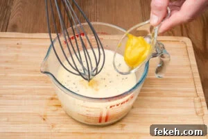 Classic Cheese Flan Recipe: Old-Fashioned Dinner Dessert 12 Pouring English mustard into the egg mixture