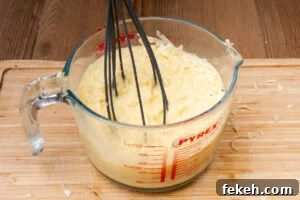 Classic Cheese Flan Recipe: Old-Fashioned Dinner Dessert 13 Whisking grated cheese into the egg mixture